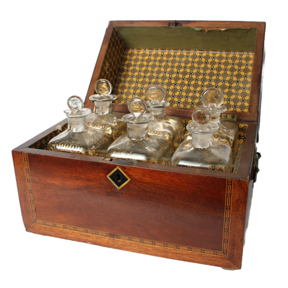 Antique mahogany liquor chest with six hand-blown gilded glass decanters