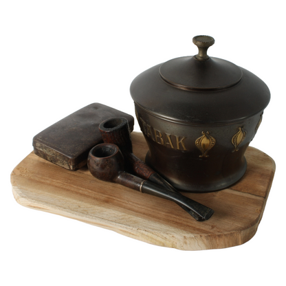 Vintage metal tobacco jar with wooden pipes, tin box and rustic wooden tray