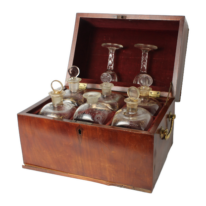 Antique mahogany tantalus with six cut-glass decanters and glasses, ca. 1790