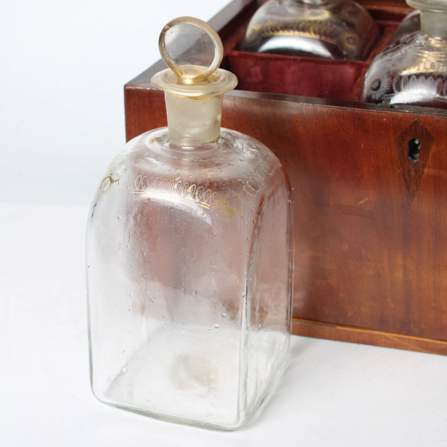 Antique mahogany tantalus with six cut-glass decanters and glasses, ca. 1790