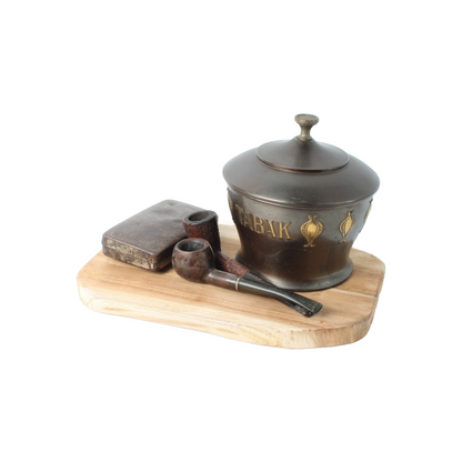 Vintage metal tobacco jar with wooden pipes, tin box and rustic wooden tray