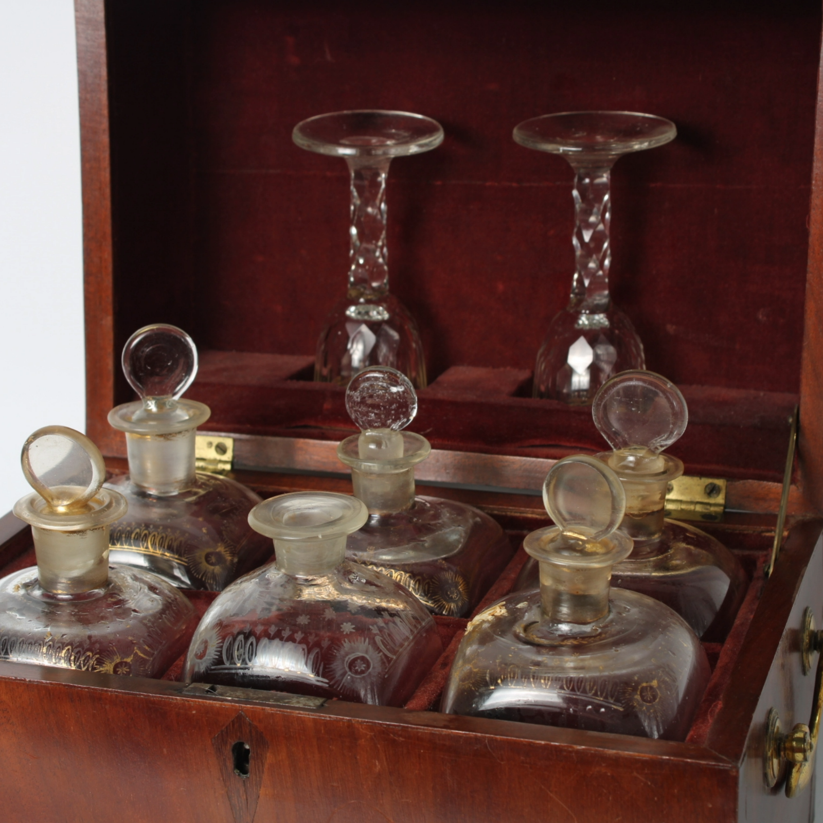 Antique mahogany tantalus with six cut-glass decanters and glasses, ca. 1790