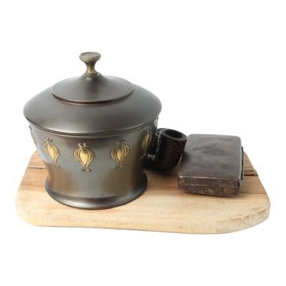Vintage metal tobacco jar with wooden pipes, tin box and rustic wooden tray