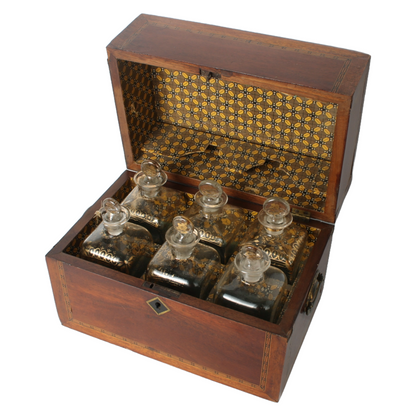 Antique mahogany liquor chest with six hand-blown gilded glass decanters